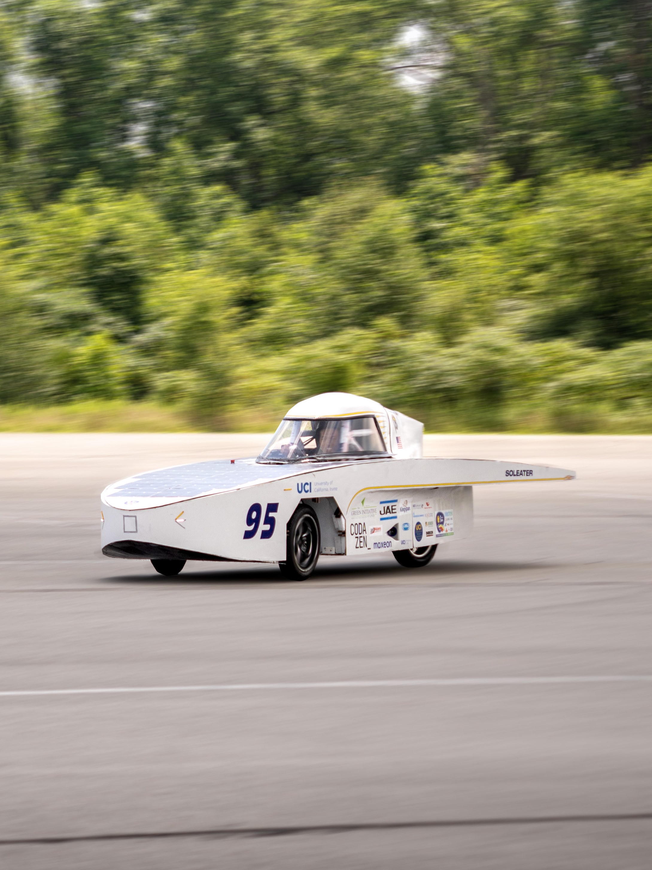 Moving car with wheel panels removed